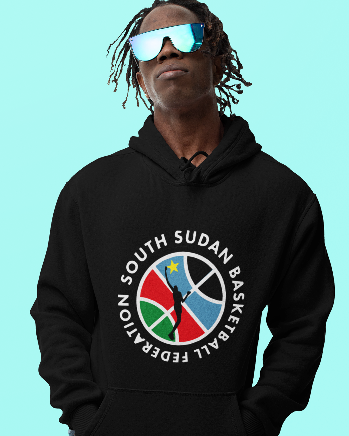 Person wearing a black hoodie with a South Sudan Basketball Federation logo on a light blue background